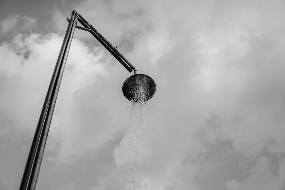 Luxurious rain shower head with flowing water
