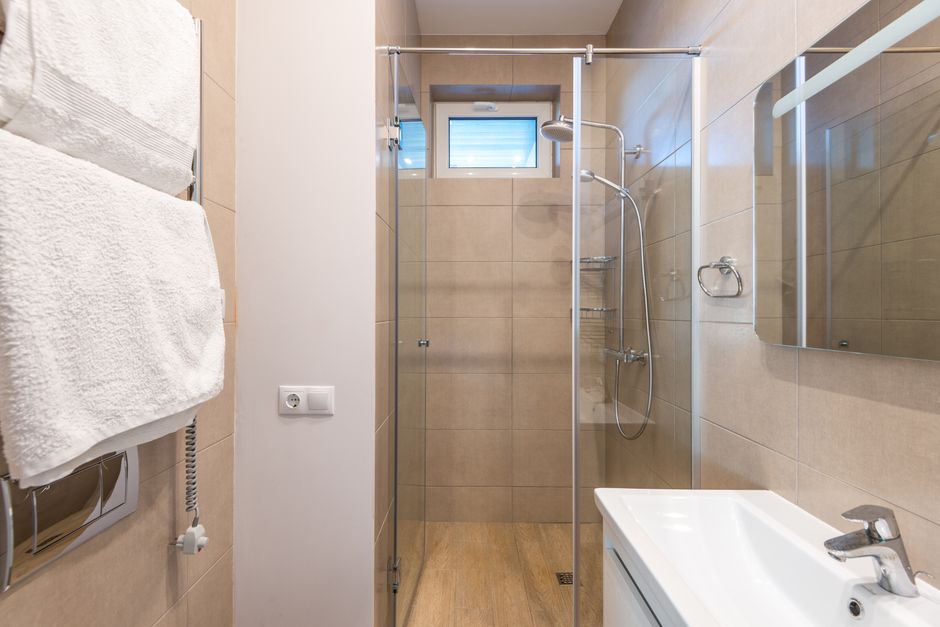 Clean glass shower door and premium bathroom finishes